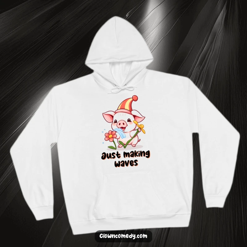 Funny hoodie featuring a playful piglet in a clown hat, humorously squirting water from a flower, offering cozy, cute comfort.