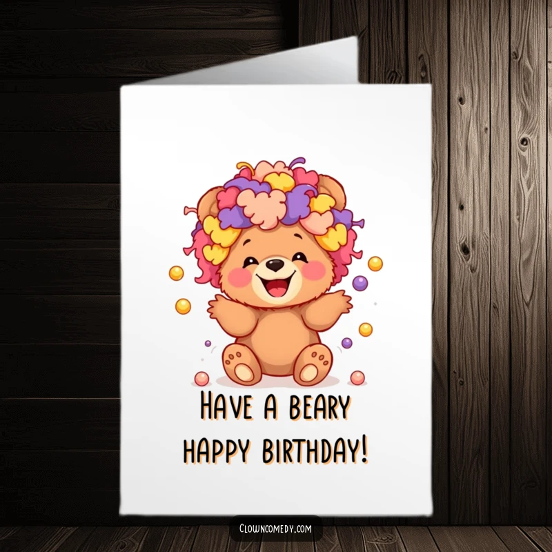 Funny Free Printable Birthday Card: Giggling bear cub in clown wig juggling balls, a hilarious downloadable gift.